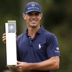 
              Billy Horschel of the U.S lifts the trophy after victory during day four of the PGA Championship at Wentworth Golf Club, Surrey, England, Sunday, Sept. 12, 2021. (Steven Paston/PA via AP)
            
