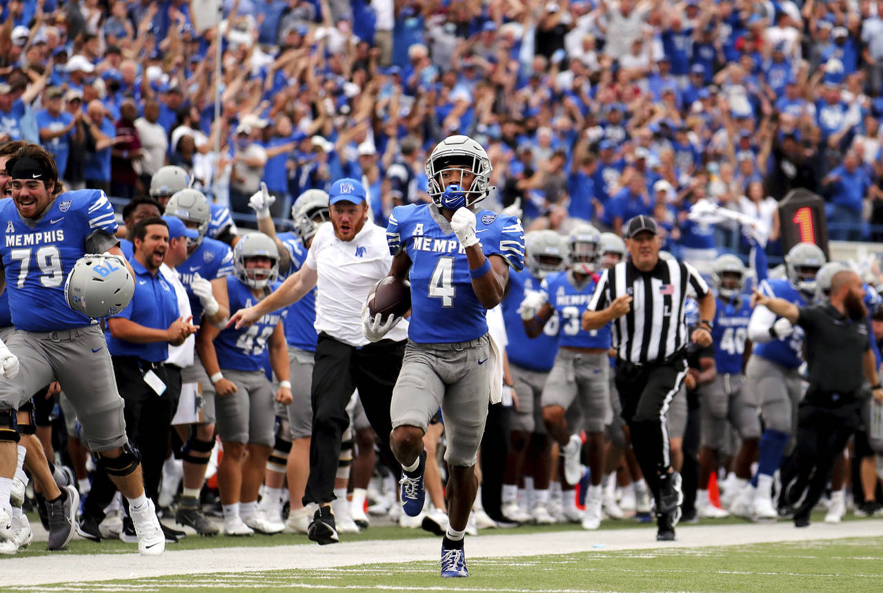 Memphis receiver Calvin Austin III (4) returns a long punt against Mississippi State during an NCAA...