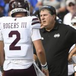 
              Mississippi State coach Mike Leach, right, talks to Mississippi State quarterback Will Rogers during the first half of an NCAA college football game against Memphis, Saturday, Sept. 18, 2021, in Memphis, Tenn. (AP Photo/John Amis)
            