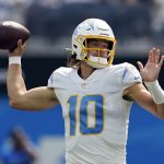 
              Los Angeles Chargers quarterback Justin Herbert (10) throws during the first half of an NFL football game against the Dallas Cowboys Sunday, Sept. 19, 2021, in Inglewood, Calif. (AP Photo/Ashley Landis )
            