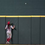 
              Los Angeles Angels center fielder Brandon Marsh watches a three-run home run ball that was hit by Texas Rangers' DJ Peters fly over the fence in the third inning of a baseball game in Arlington, Texas, Thursday, Sept. 30, 2021. (AP Photo/Tony Gutierrez)
            