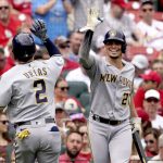 
              Milwaukee Brewers' Luis Urias (2) is congratulated by teammate Willy Adames (27) after hitting a solo home run during the third inning of a baseball game against the St. Louis Cardinals Thursday, Sept. 30, 2021, in St. Louis. (AP Photo/Jeff Roberson)
            
