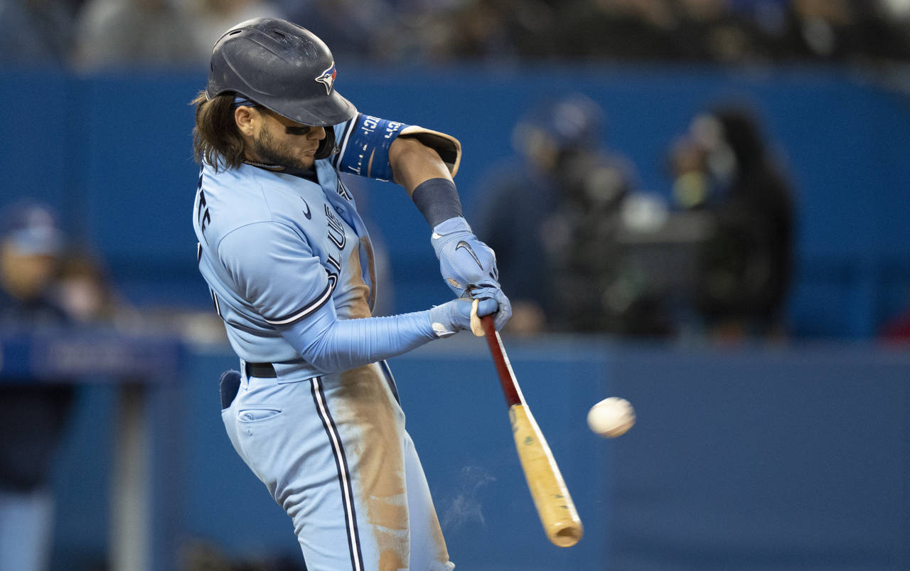 Toronto Blue Jays shortstop Bo Bichette (11) hits the game winning solo home run during the eighth ...