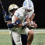 
              North Carolina quarterback Sam Howell (7) fumbles as he is tackled by Georgia Tech defensive lineman Jordan Domineck. during the first half of an NCAA college football game Saturday, Sept. 25, 2021, in Atlanta. Georgia Tech recovered the ball. (AP Photo/John Bazemore)
            