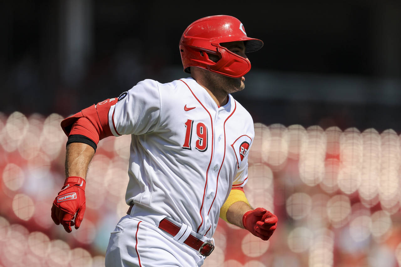 Cincinnati Reds' Joey Votto runs the bases after hitting a two-run home run during the first inning...