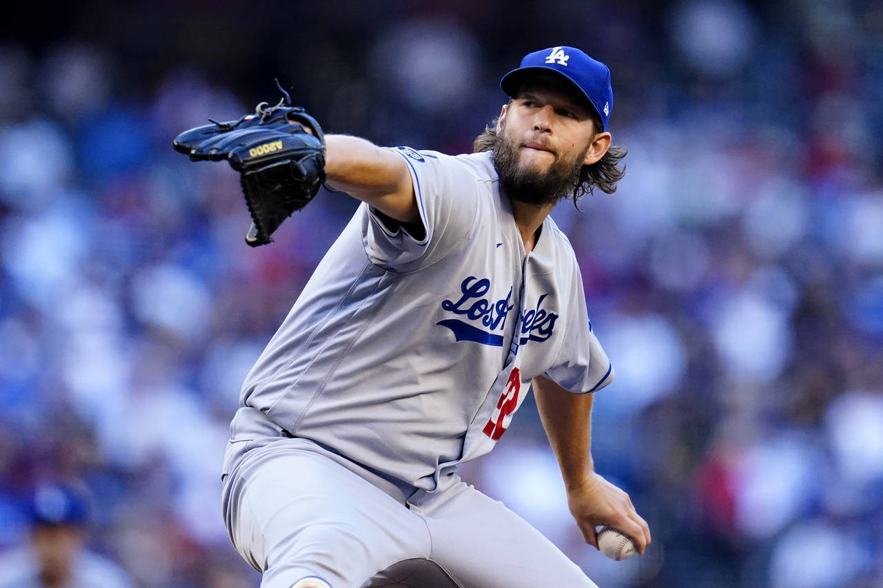 Los Angeles Dodgers starting pitcher Clayton Kershaw throws a pitch against the Arizona Diamondback...