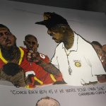 
              Artwork showing legendary Grambling football coach Eddie Robinson is displayed at the College Football Hall of Fame, Thursday, Sept. 2, 2021, in Atlanta. The Hall has a new exhibit dedicated to historically black colleges and universities. (AP Photo/John Bazemore)
            