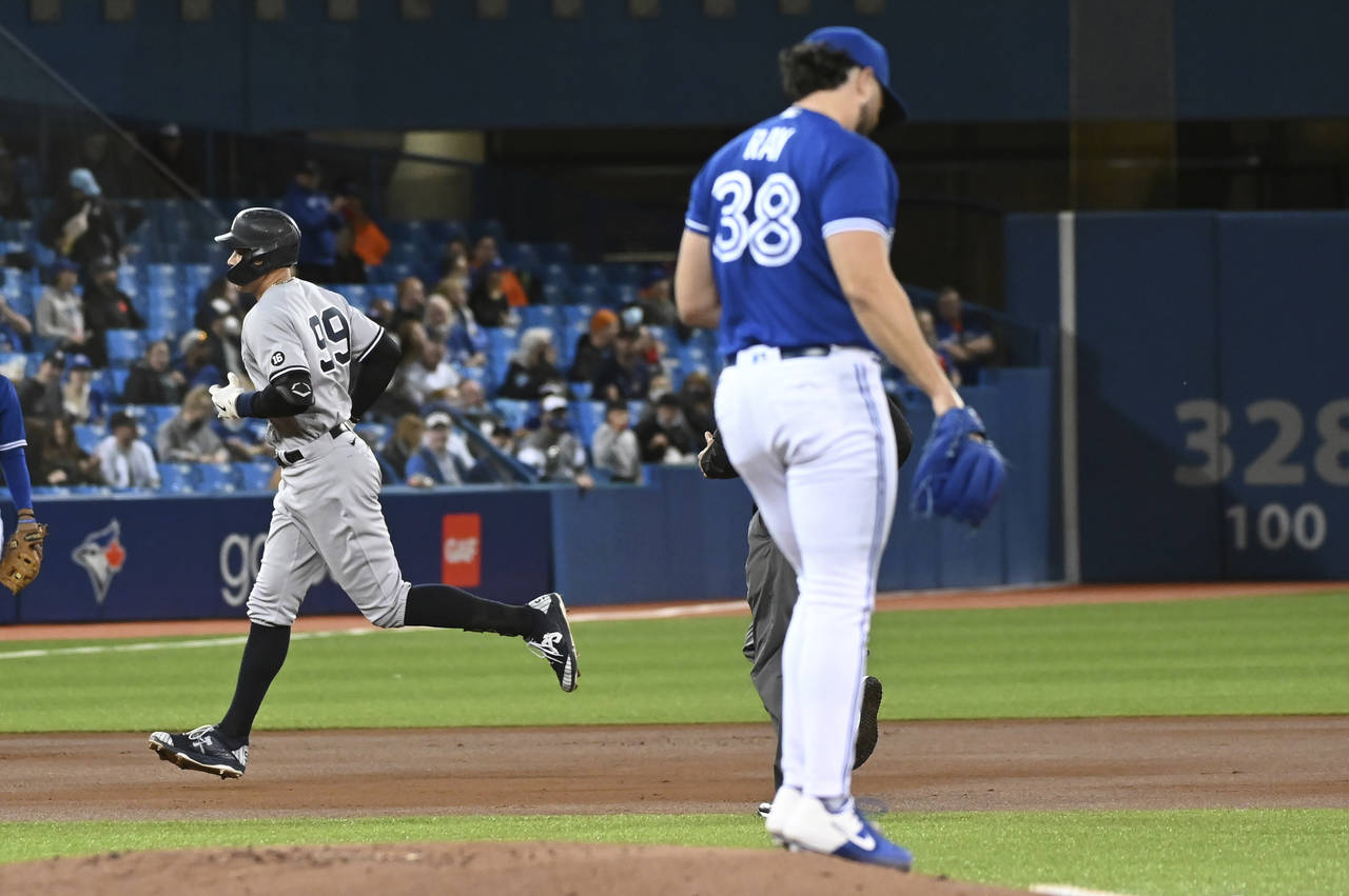 New York Yankees' Aaron Judge (99) rounds the bases after hitting a solo home run off Toronto Blue ...