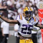 
              LSU cornerback Cordale Flott (25) celebrates intercepting a Mississippi State pass during the first half of an NCAA college football game, Saturday, Sept. 25, 2021, in Starkville, Miss. (AP Photo/Rogelio V. Solis)
            