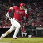 
              Los Angeles Angels designated hitter Shohei Ohtani rounds first on his way to a triple during the third inning of a baseball game against the Seattle Mariners Saturday, Sept. 25, 2021, in Anaheim, Calif. (AP Photo/Mark J. Terrill)
            