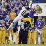 
              LSU wide receiver Deion Smith (6) catches a pass for a touchdown next to Central Michigan defensive back Donte Kent (19) during the first quarter of an NCAA college football game in Baton Rouge, La,. Saturday, Sept. 18, 2021. (AP Photo/Derick Hingle)
            