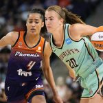 
              New York Liberty guard Sabrina Ionescu (20) drives past Phoenix Mercury guard Skylar Diggins-Smith during the second half in the first round of the WNBA basketball playoffs, Thursday, Sept. 23, 2021, in Phoenix. Phoenix won 83-82. (AP Photo/Rick Scuteri)
            