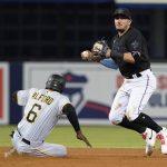 
              Pittsburgh Pirates' Anthony Alford (6) is forced out at second base as Miami Marlins shortstop Miguel Rojas looks to first, where Michael Perez was safe during the seventh inning of a baseball game Saturday, Sept. 18, 2021, in Miami. (AP Photo/Marta Lavandier)
            