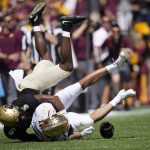 
              Colorado safety Mark Perry, top, tackles Minnesota wide receiver Chris Autman-Bell after he caught a pass in the second half of an NCAA college football game Saturday, Sept. 18, 2021, in Boulder, Colo. Minnesota won 30-0. (AP Photo/David Zalubowski)
            