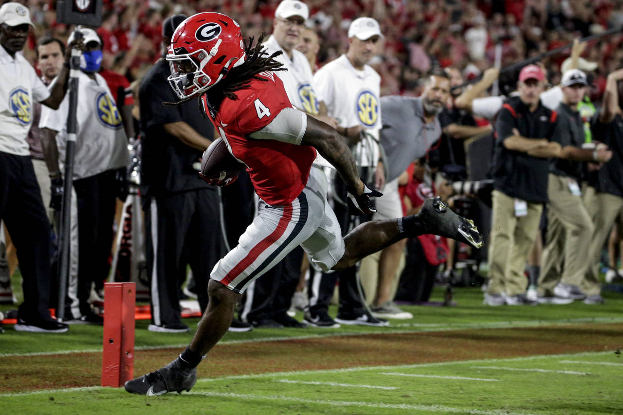 Georgia running back James Cook carries the ball in for a touchdown against South Carolina during t...