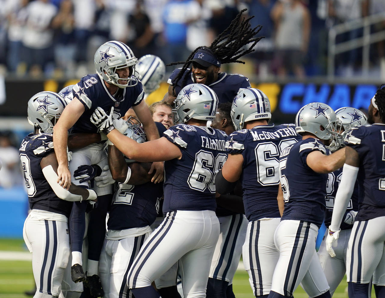 Dallas Cowboys kicker Greg Zuerlein (2) is lifted by teammates after making the game-winning field ...
