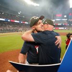 
              Atlanta Braves' Adam Duvall, left, hugs manager Brian Snitker, after a baseball game against the Philadelphia Phillies, Thursday, Sept. 30, 2021, in Atlanta. The Braves clinched the National League East title. (AP Photo/John Bazemore)
            