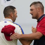 
              Team USA's Bryson DeChambeau shakes hands with Team Europe's Sergio Garcia after winning on the 16th hole during a Ryder Cup singles match at the Whistling Straits Golf Course Sunday, Sept. 26, 2021, in Sheboygan, Wis. (AP Photo/Jeff Roberson)
            