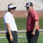 
              Missouri head coach Eliah Drinkwitz, left, laughs with Southeast Missouri head coach Tom Matukewicz, right, as they watch teams warmup before the start of an NCAA college football game Saturday, Sept. 18, 2021, in Columbia, Mo. (AP Photo/L.G. Patterson)
            
