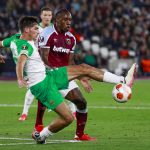 
              West Ham's Michail Antonio watches as Rapid Vienna's Leo Greiml, left, clears the ball during the Europa League Group H soccer match between West Ham and Rapid Vienna at London Stadium in London, Thursday, Sept. 30, 2021. (AP Photo/Ian Walton)
            