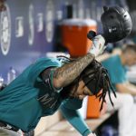SEATTLE, WASHINGTON - OCTOBER 01: J.P. Crawford #3 of the Seattle Mariners slams his helmet after popping out during the eighth inning against the Los Angeles Angels at T-Mobile Park on October 01, 2021 in Seattle, Washington. (Photo by Steph Chambers/Getty Images)