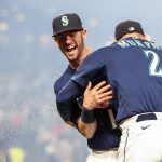 SEATTLE, WASHINGTON - OCTOBER 02: Mitch Haniger #17 and Tom Murphy #2 of the Seattle Mariners celebrate after beating the Los Angeles Angels 6-4 at T-Mobile Park on October 02, 2021 in Seattle, Washington. (Photo by Steph Chambers/Getty Images)