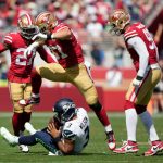 SANTA CLARA, CALIFORNIA - OCTOBER 03: Nick Bosa #97 of the San Francisco 49ers sacks Russell Wilson #3 of the Seattle Seahawks during the first quarter against the Seattle Seahawks at Levi's Stadium on October 03, 2021 in Santa Clara, California. (Photo by Thearon W. Henderson/Getty Images)