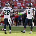 SANTA CLARA, CALIFORNIA - OCTOBER 03: Quandre Diggs #6 and Ugo Amadi #28 of the Seattle Seahawks celebrate a broken-up pass play during the second half against the San Francisco 49ers at Levi's Stadium on October 03, 2021 in Santa Clara, California. (Photo by Ezra Shaw/Getty Images)