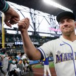 SEATTLE, WASHINGTON - OCTOBER 03: Kyle Seager #15 of the Seattle Mariners fist bumps fans after his team's loss to the Los Angeles Angels 7-3 to end their season at T-Mobile Park on October 03, 2021 in Seattle, Washington. (Photo by Steph Chambers/Getty Images)
