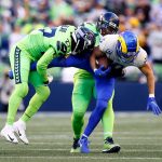 SEATTLE, WASHINGTON - OCTOBER 07: Defensive back Marquise Blair #27 of the Seattle Seahawks tackles wide receiver Cooper Kupp #10 of the Los Angeles Rams in the first half at Lumen Field on October 07, 2021 in Seattle, Washington. (Photo by Steph Chambers/Getty Images)