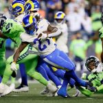 SEATTLE, WASHINGTON - OCTOBER 07: Running back Darrell Henderson #27 of the Los Angeles Rams rushes for a second half touchdown against the Seattle Seahawks at Lumen Field on October 07, 2021 in Seattle, Washington. (Photo by Steph Chambers/Getty Images)