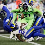 SEATTLE, WASHINGTON - OCTOBER 07: Running back Darrell Henderson #27 of the Los Angeles Rams rushes for a second half touchdown against the Seattle Seahawks at Lumen Field on October 07, 2021 in Seattle, Washington. (Photo by Steph Chambers/Getty Images)
