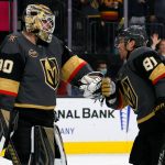 LAS VEGAS, NEVADA - OCTOBER 12:  Robin Lehner #90 and Jonathan Marchessault #81 of the Vegas Golden Knights celebrate on the ice after the team's 4-3 victory over the Seattle Kraken in the Kraken's inaugural regular-season game at T-Mobile Arena on October 12, 2021 in Las Vegas, Nevada.  (Photo by Ethan Miller/Getty Images)