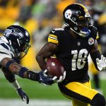 PITTSBURGH, PENNSYLVANIA - OCTOBER 17: Diontae Johnson #18 of the Pittsburgh Steelers rushes ahead of Jamal Adams #33 of the Seattle Seahawks during the second quarter at Heinz Field on October 17, 2021 in Pittsburgh, Pennsylvania. (Photo by Joe Sargent/Getty Images)