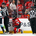 NEWARK, NEW JERSEY - OCTOBER 19: Jack Hughes #86 of the New Jersey Devils is injured during the first period against the Seattle Kraken at the Prudential Center on October 19, 2021 in Newark, New Jersey. (Photo by Bruce Bennett/Getty Images)
