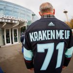 SEATTLE, WASHINGTON - OCTOBER 23:  A fan poses for a photo prior to the Kraken's inaugural home opening game on October 23, 2021 at the Climate Pledge Arena in Seattle, Washington. (Photo by Steph Chambers/Getty Images)