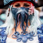 SEATTLE, WASHINGTON - OCTOBER 23:  A fan poses for a photo prior to the Kraken's inaugural home opening game on October 23, 2021 at the Climate Pledge Arena in Seattle, Washington. (Photo by Steph Chambers/Getty Images)