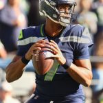 SEATTLE, WASHINGTON - OCTOBER 31: Geno Smith #7 of the Seattle Seahawks looks to throw the ball during the first quarter against the Jacksonville Jaguars at Lumen Field on October 31, 2021 in Seattle, Washington. (Photo by Abbie Parr/Getty Images)