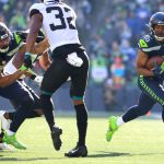 SEATTLE, WASHINGTON - OCTOBER 31: Tyler Lockett #16 of the Seattle Seahawks runs the ball after a catch during the second quarter against the Jacksonville Jaguars at Lumen Field on October 31, 2021 in Seattle, Washington. (Photo by Abbie Parr/Getty Images)