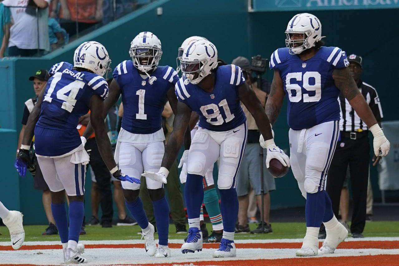 Indianapolis Colts tight end Mo Alie-Cox (81) celebrates with teammates, offensive tackle Matt Pryo...