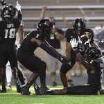 
              Hawaii defensive back Hugh Nelson II (3) reacts with defensive back Khoury Bethley (5) and defensive back Quentin Frazier (19) after Nelson made an interception against Fresno State during the fourth quarter of an NCAA college football game, Saturday, Oct. 2, 2021, in Honolulu. (AP Photo/Marco Garcia)
            