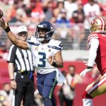 
              Seattle Seahawks quarterback Russell Wilson (3) passes against San Francisco 49ers defensive end Arik Armstead (91) during the first half of an NFL football game in Santa Clara, Calif., Sunday, Oct. 3, 2021. (AP Photo/Tony Avelar)
            