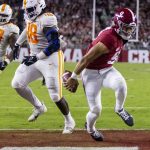 
              Alabama quarterback Bryce Young (9) runs for a touchdown past Tennessee defensive lineman Ja'Quain Blakely (48) during the first half of an NCAA college football game Saturday, Oct. 23, 2021, in Tuscaloosa, Ala. (AP Photo/Vasha Hunt)
            