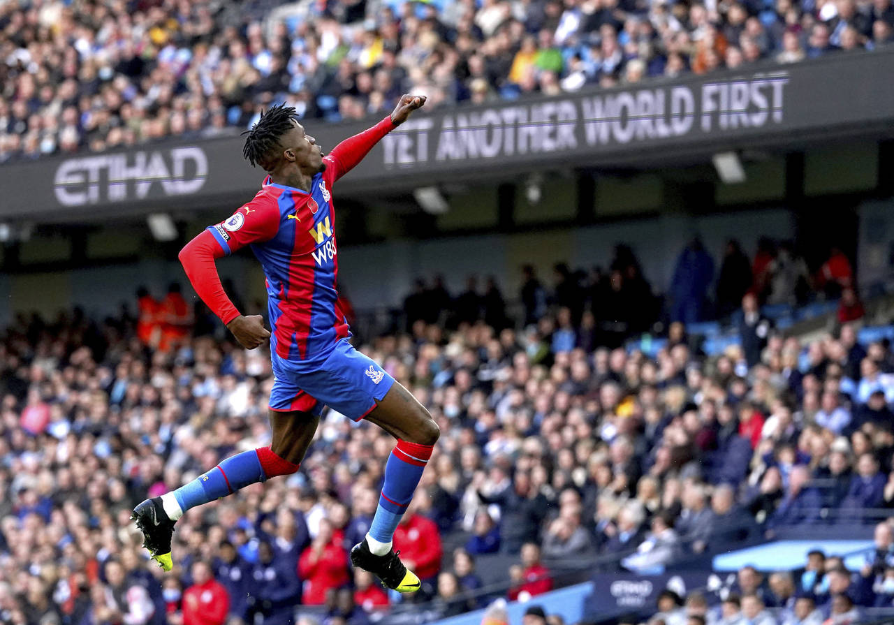 Crystal Palace's Wilfried Zaha celebrates scoring during the English Premier League soccer match be...