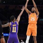 
              Phoenix Suns forward Mikal Bridges (25) shoots over Los Angeles Lakers guard Malik Monk during the first half of an NBA basketball game Friday, Oct. 22, 2021, in Los Angeles. (AP Photo/Marcio Jose Sanchez)
            