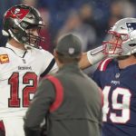 
              Tampa Bay Buccaneers quarterback Tom Brady (12) meets with New England Patriots long snapper Joe Cardona (49) prior to an NFL football game between the New England Patriots and Tampa Bay Buccaneers, Sunday, Oct. 3, 2021, in Foxborough, Mass. (AP Photo/Steven Senne)
            