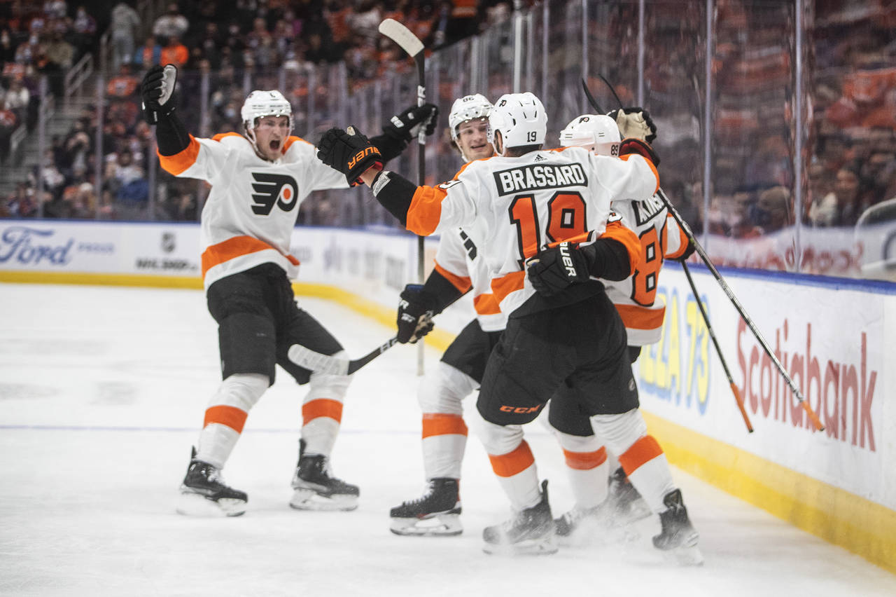 Philadelphia Flyers players celebrate a goal against the Edmonton Oilers during the first period of...