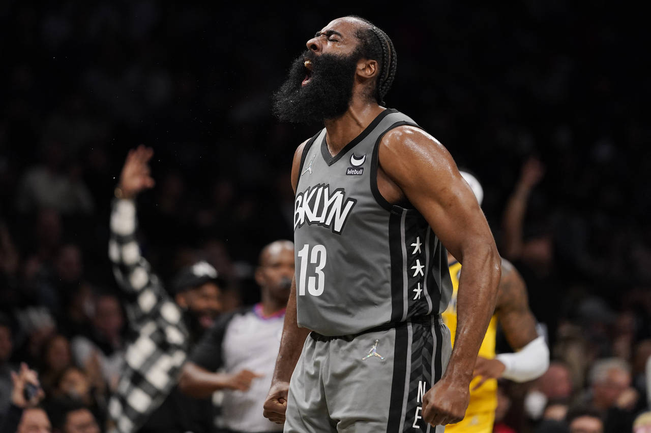 Brooklyn Nets guard James Harden reacts after scoring during the first half of the team's NBA baske...