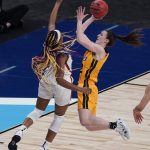 
              FILE - Iowa guard Caitlin Clark (22) drives to the basket against UConn forward Aaliyah Edwards (3) during the first half of a college basketball game in the Sweet Sixteen round of the women's NCAA tournament at the Alamodome in San Antonio, in this Saturday, March 27, 2021, file photo. Clark was named to the preseason Associated Press NCAA college basketball All-America team on Tuesday, Oct. 26, 2021. (AP Photo/Eric Gay, File)
            