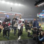 
              Tampa Bay Buccaneers quarterback Tom Brady (12) waves to fans after defeating the New England Patriots 19-17 in an NFL football game, Sunday, Oct. 3, 2021, in Foxborough, Mass. (AP Photo/Steven Senne)
            
